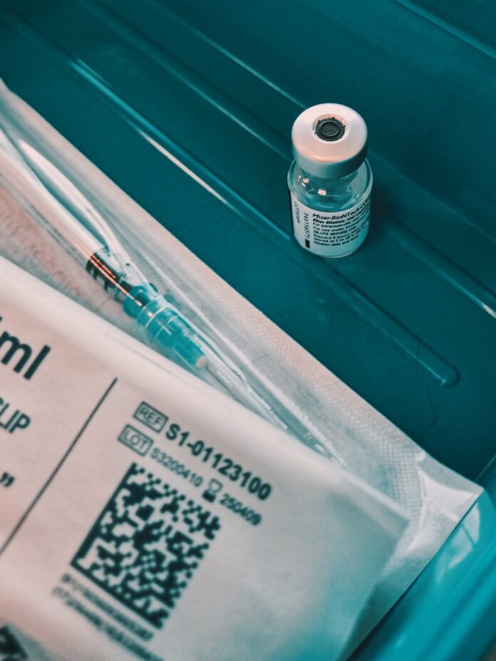 Photo by Samuel Regan-Asante white and black labeled bottle